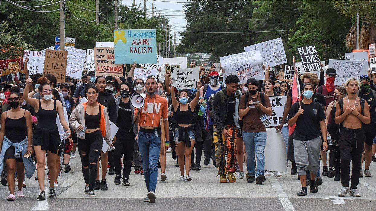 Demonstrators march in a Black Lives Matter