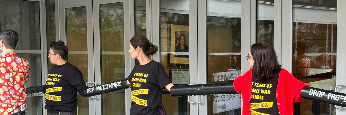 Demonstrators padlock their arms together in front of Rep. Nancy Pelosi's office