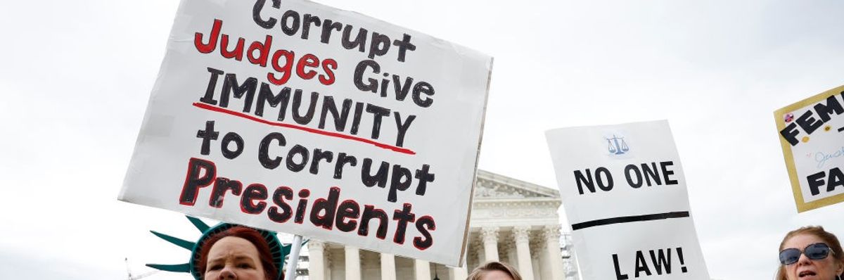 Demonstrators participate in a protest outside the U.S. Supreme Court