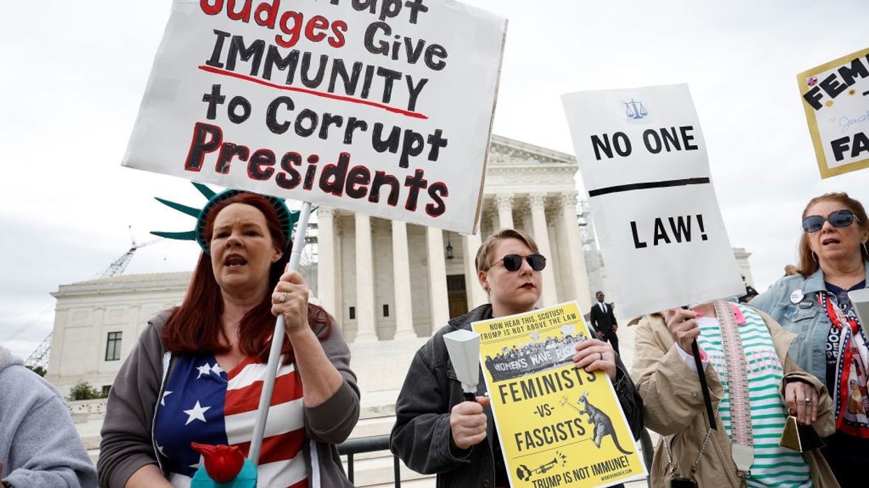 Demonstrators participate in a protest outside the U.S. Supreme Court