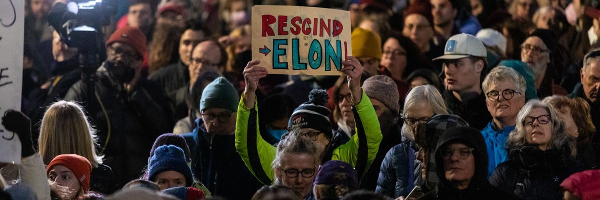 Demonstrators participate in a rally in front of the U.S. Treasury Department
