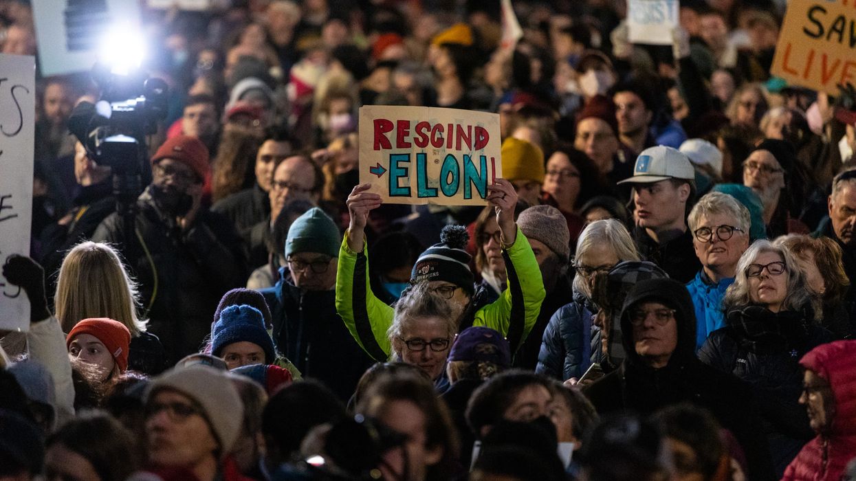Demonstrators participate in a rally in front of the U.S. Treasury Department