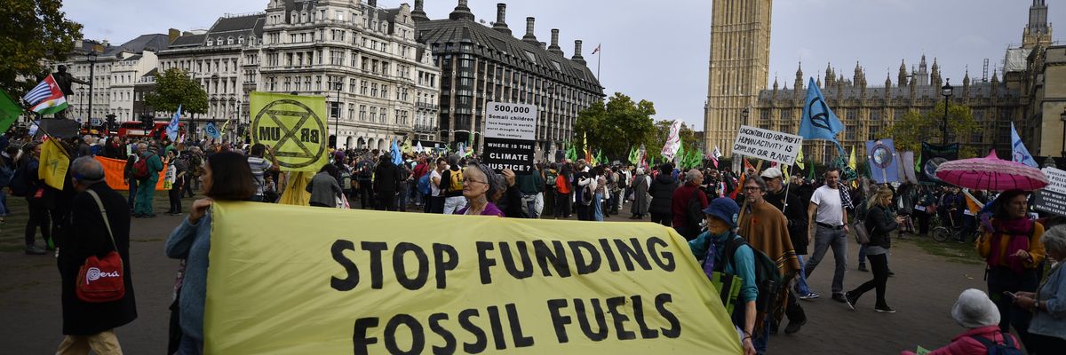 Demonstrators participate in an Extinction Rebellion protest at Parliament Square in London on October 16, 2022.