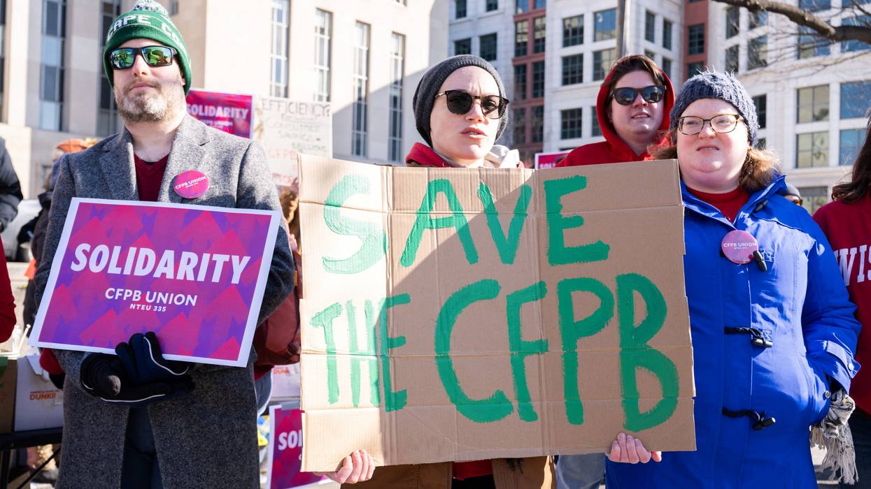 Demonstrators protest against cuts to the U.S. Consumer Financial Protection Bureau