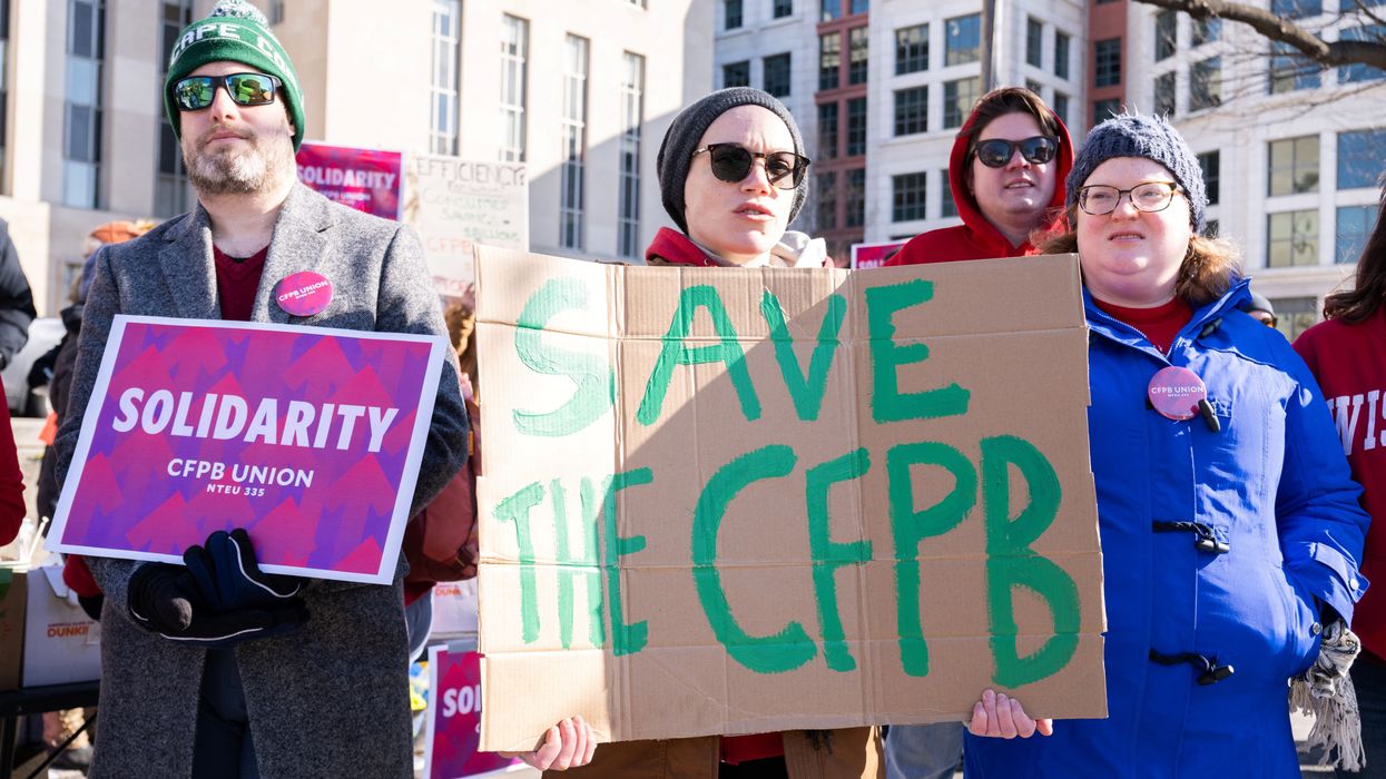 Demonstrators protest against cuts to the U.S. Consumer Financial Protection Bureau
