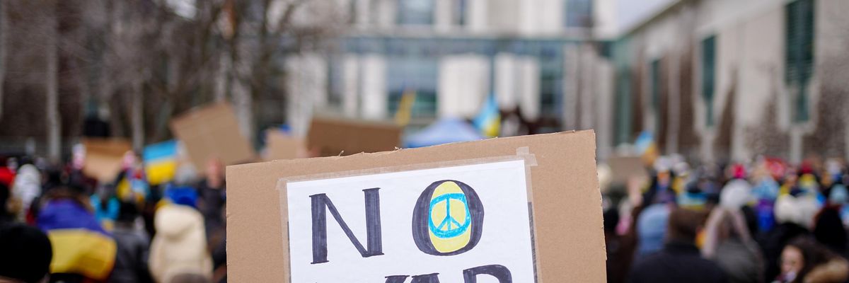 Demonstrators protest against the war and the Russian invasion of Ukraine in front of the Federal Chancellery on February 25, 2022 in Berlin