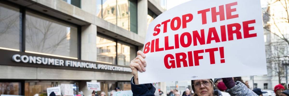 Demonstrators protest attacks on the Consumer Financial Protection Bureau