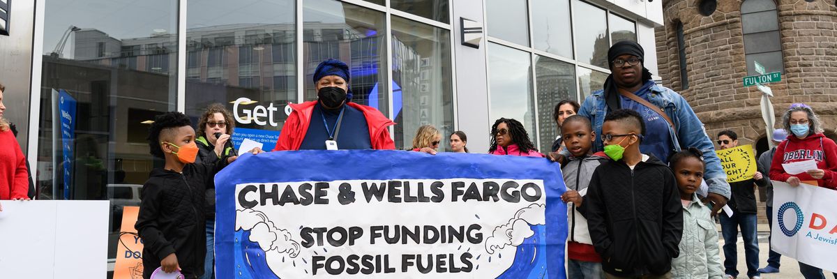 Demonstrators protest Chase and Wells Fargo's complicity in the climate emergency in Newark, New Jersey on April 21, 2022