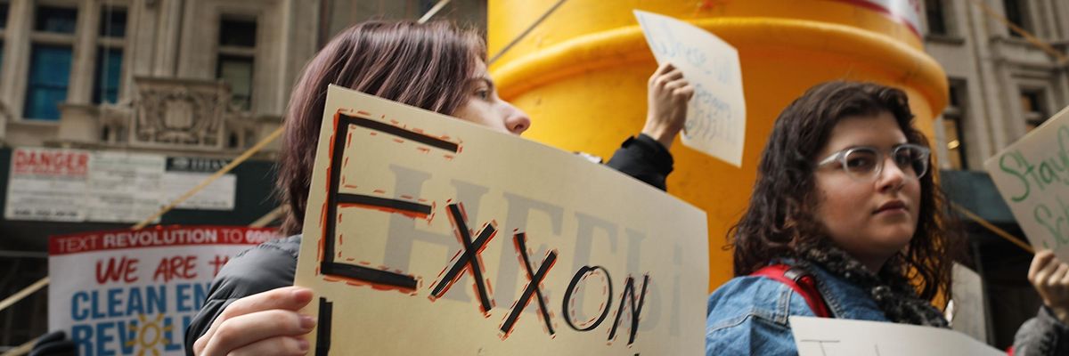 Demonstrators protest Exxon's climate lies