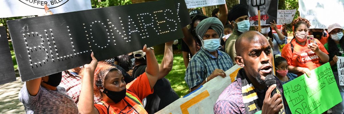 Demonstrators protest outside of Michael Bloomberg's home