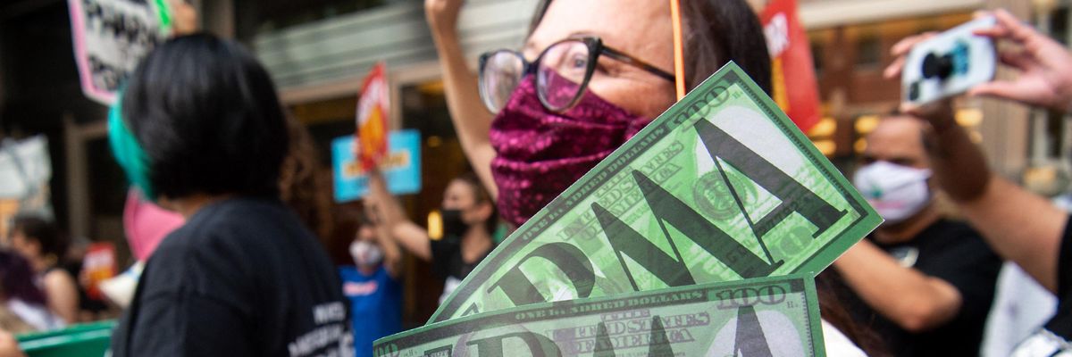 Demonstrators protest outside PhRMA headquarters.