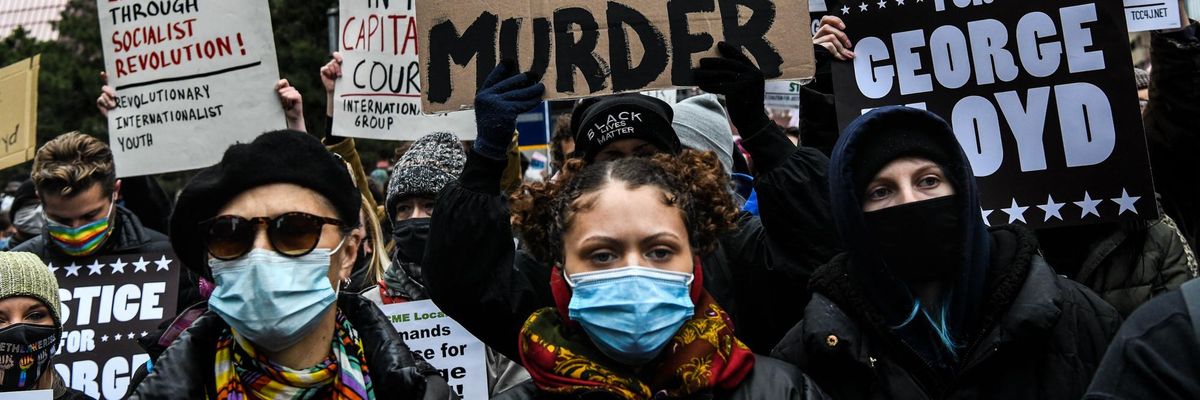 Demonstrators protest outside the Hennepin County Courthouse in downtown Minneapolis on April 19, 2021 during the trial of former police officer Derek Chauvin, who was found guilty of murdering unarmed Black man George Floyd in May 2020