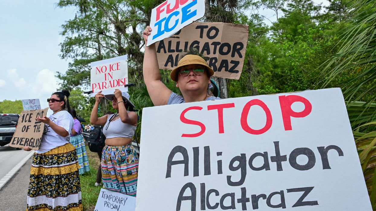 Demonstrators protest the construction of an immigrant detention center, dubbed "Alligator Alcatraz,"