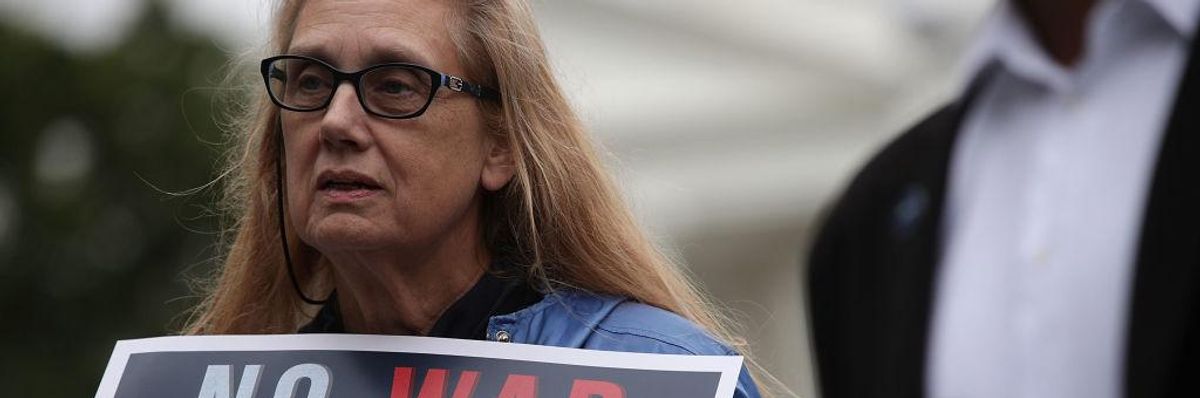 Demonstrators protest the Trump administration's march to war with Iran