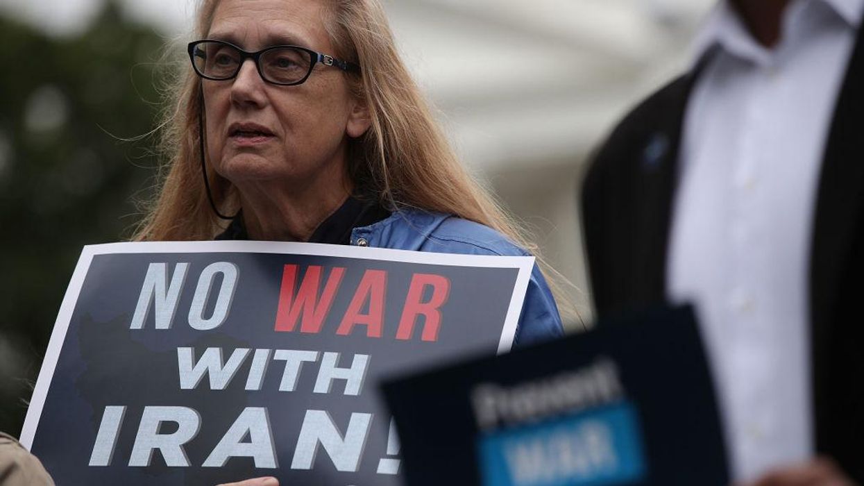 Demonstrators protest the Trump administration's march to war with Iran