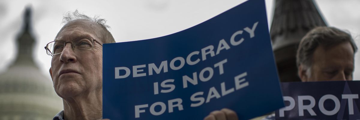 Demonstrators rally against the Supreme Court's Citizens United decision