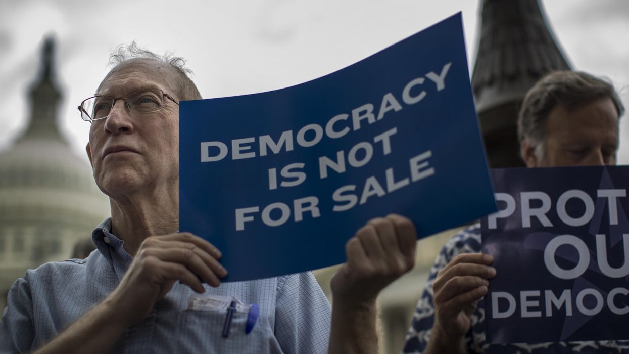 Demonstrators rally against the Supreme Court's Citizens United decision