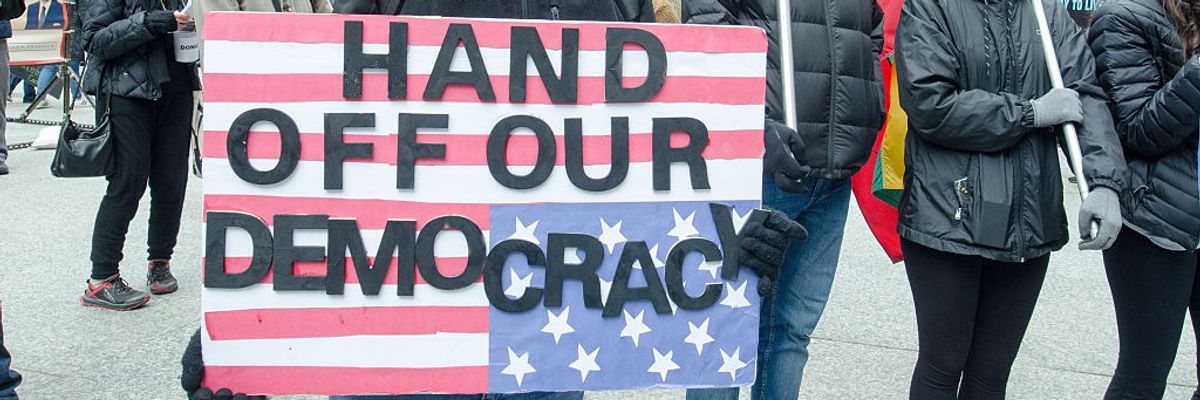 demonstrators rally against the Trump administration in Chicago