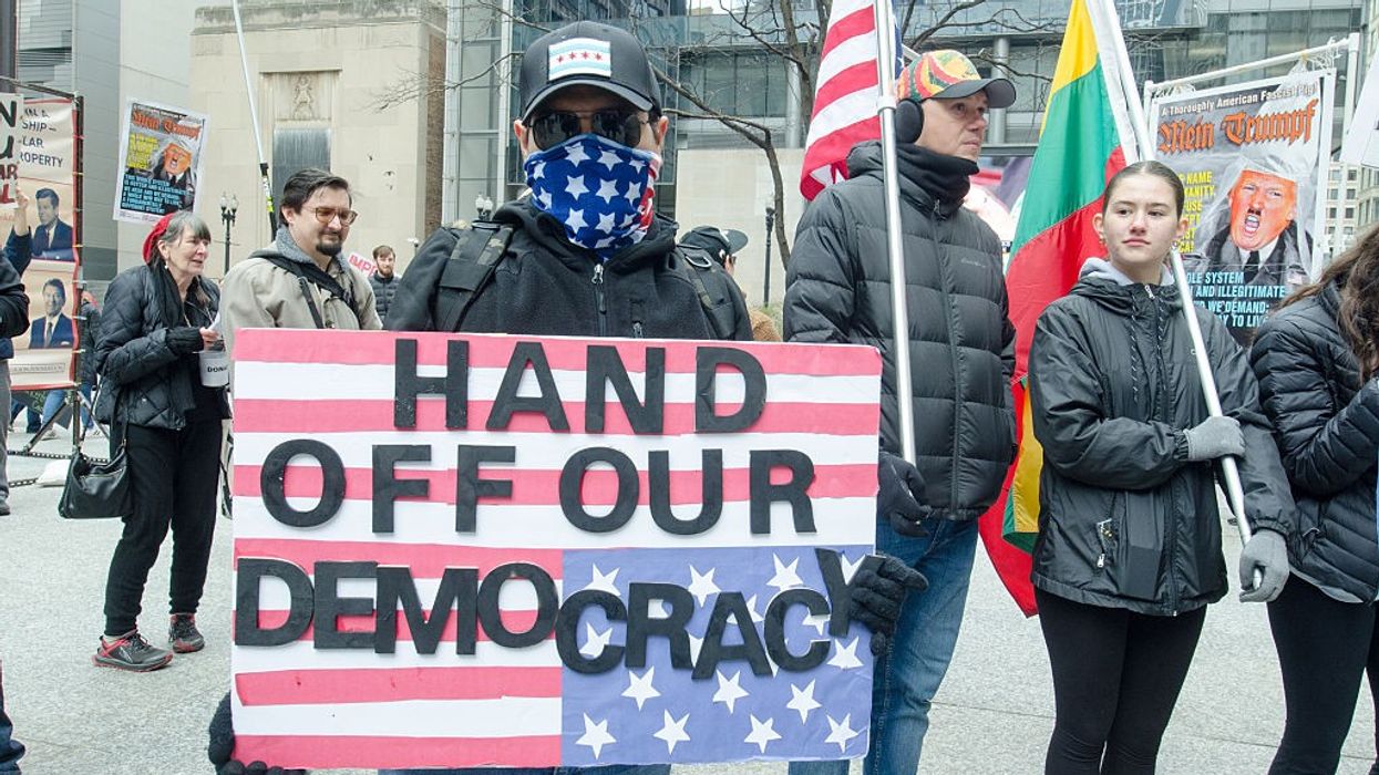 demonstrators rally against the Trump administration in Chicago