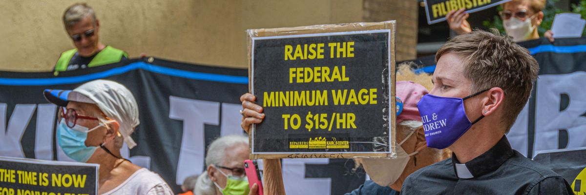 Demonstrators rally in support of a $15 federal minimum wage