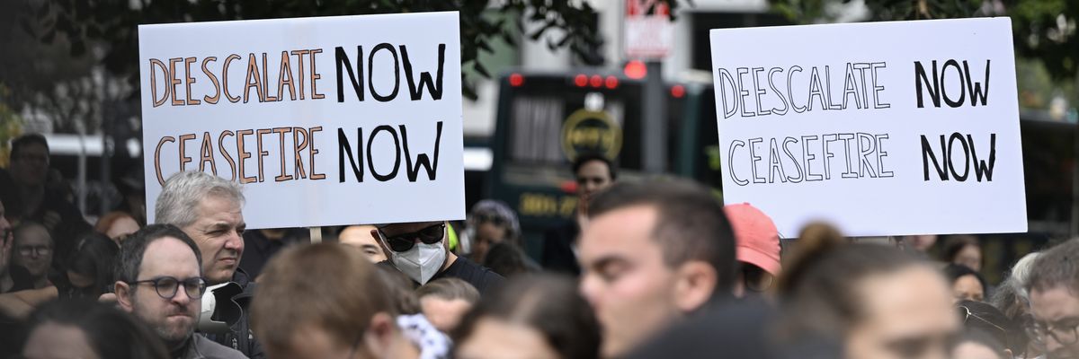 Demonstrators rally in support of a cease-fire