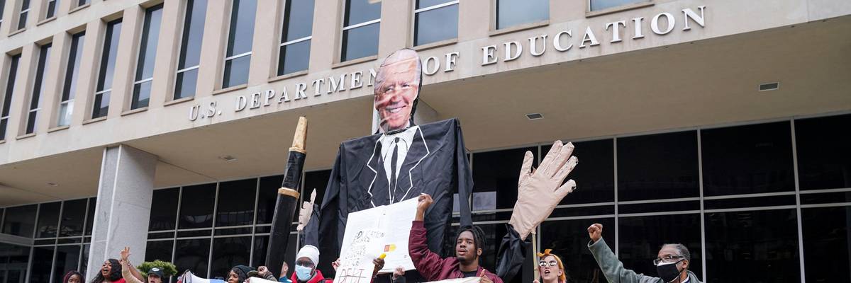 Demonstrators rally outside of U.S. Department of Education