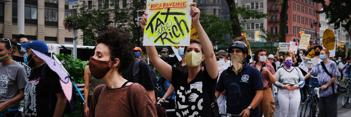 Demonstrators take part in a "March on Billionaires" event