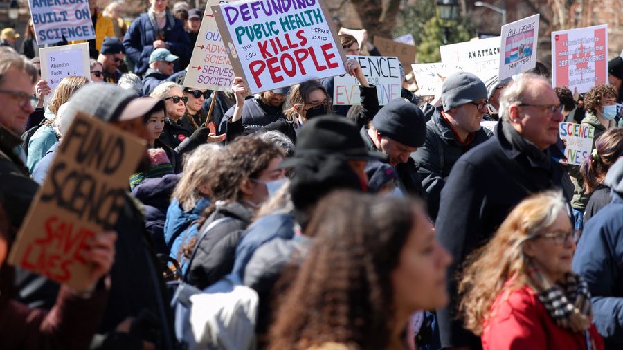 Demonstrators take part in a "Stand Up For Science" rally