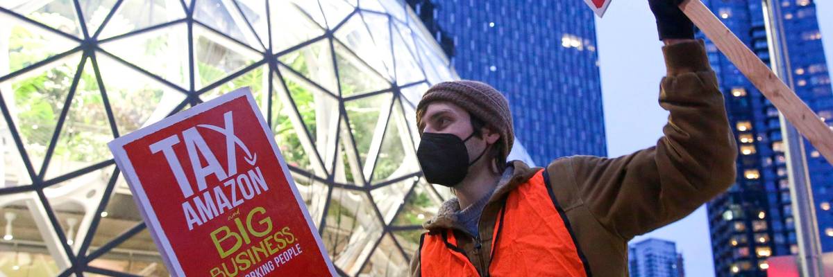 Demonstrators take part in a Tax Amazon protest