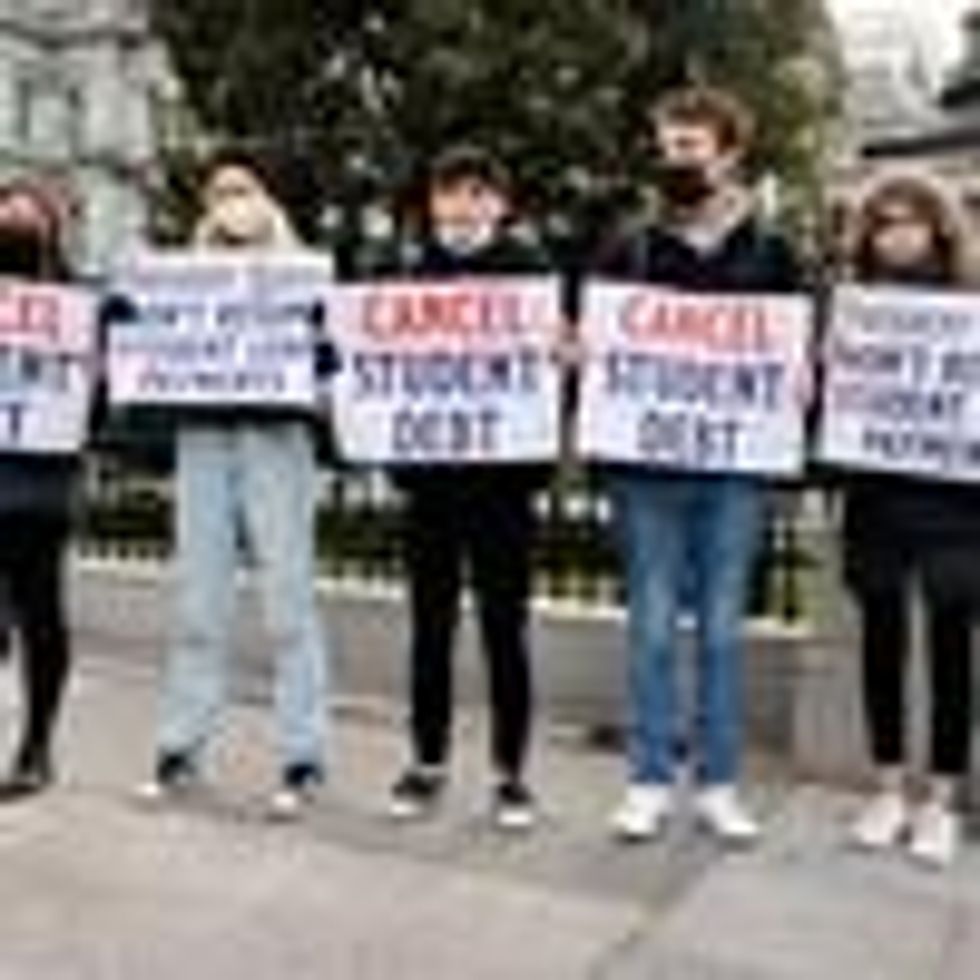Demonstrators urge President Joe Biden to cancel student debt.