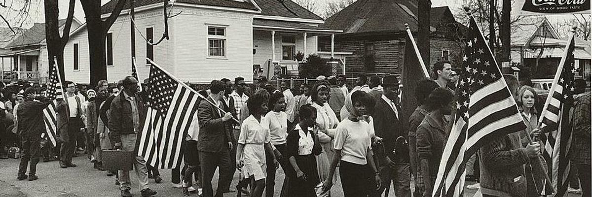 Demonstrators walk down a street during the civil rights march from Selma to Montgomery, Alabama in 1965.