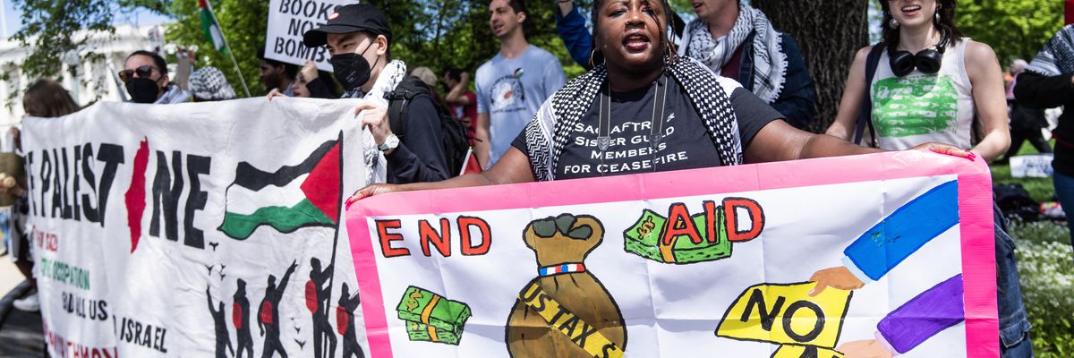 Demonstrators with posters calling for no funding for Israel.