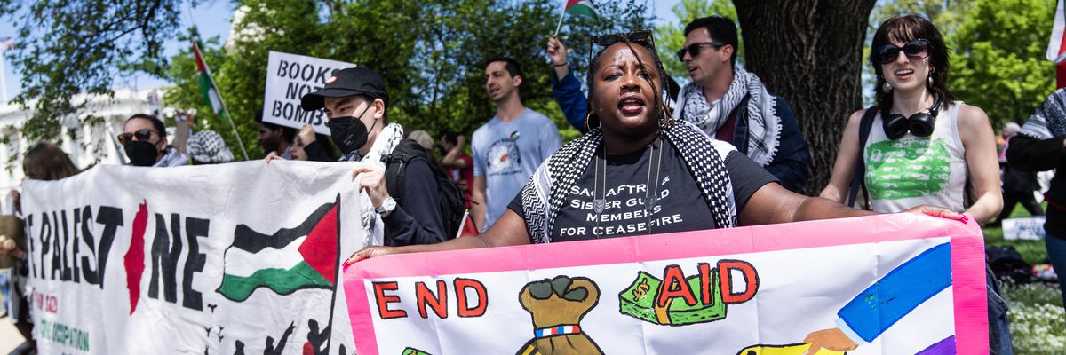 Demonstrators with posters calling for no funding for Israel.
