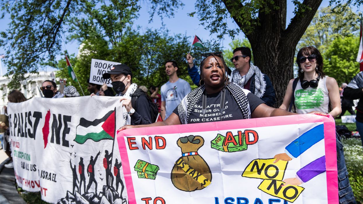 Demonstrators with posters calling for no funding for Israel.