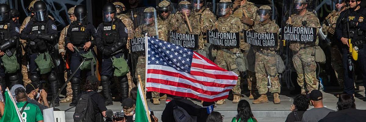 Demonstrators with U.S. and Mexican flags face off against National Guard in LA.
