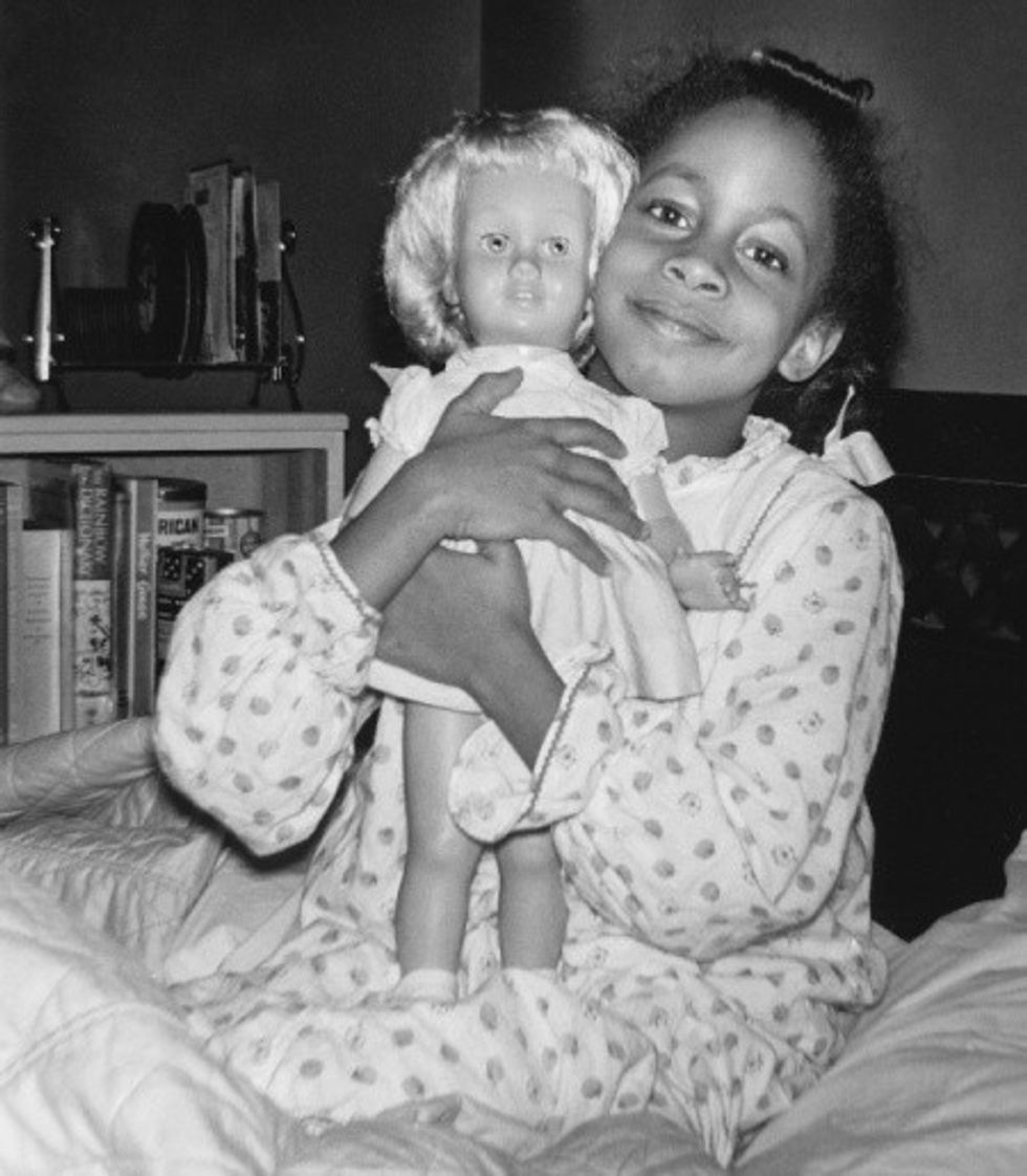 Denise McNair, killed in the 16th Street Baptist Church bombing, poses with her favorite Chatty Cathy doll.