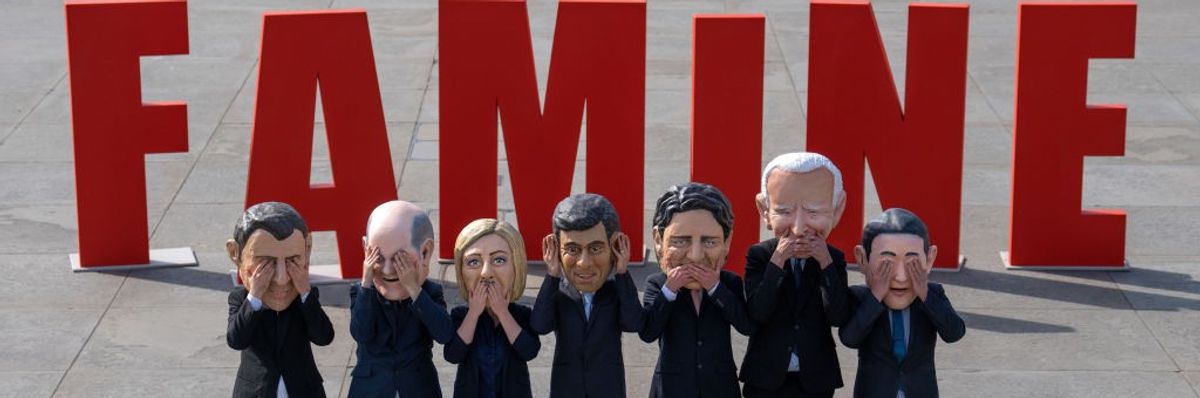 depictions of G7 leaders in front of 'FAMINE'