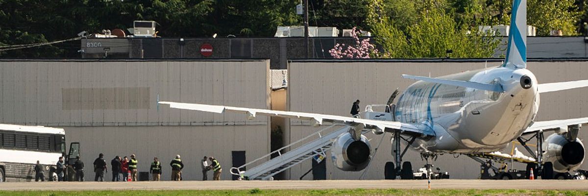 Detainees Are Loaded Onto ICE Flights At Seattle's King County International Airport