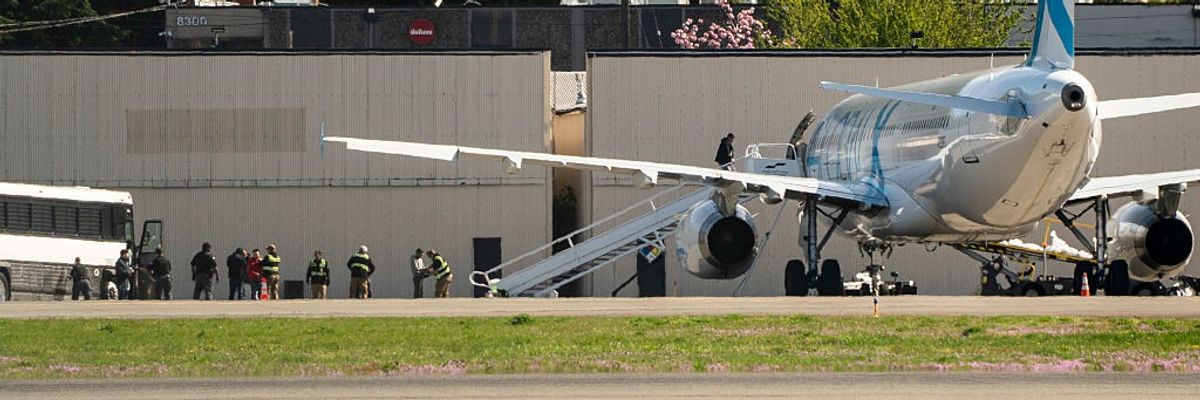 Detainees Are Loaded Onto ICE Flights At Seattle's King County International Airport