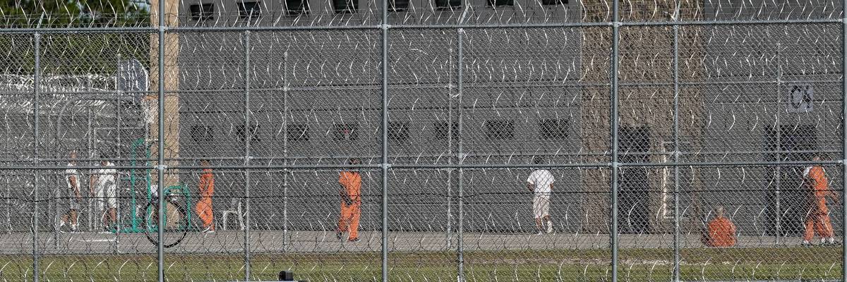 Detainees are seen in a yard at the Folkston Immigration and Customs Enforcement Processing Center