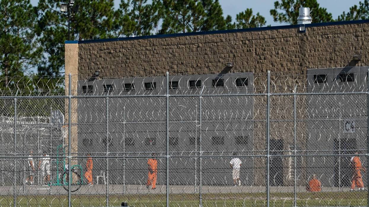 Detainees are seen in a yard at the Folkston Immigration and Customs Enforcement Processing Center