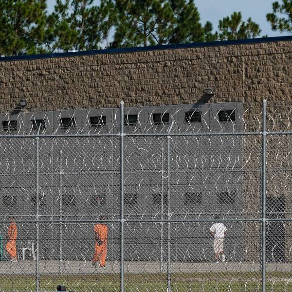 Detainees are seen in a yard at the Folkston Immigration and Customs Enforcement Processing Center