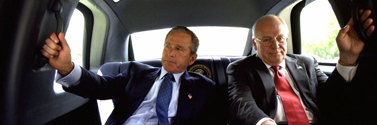 Dick Cheney and George W. Bush in a limo.