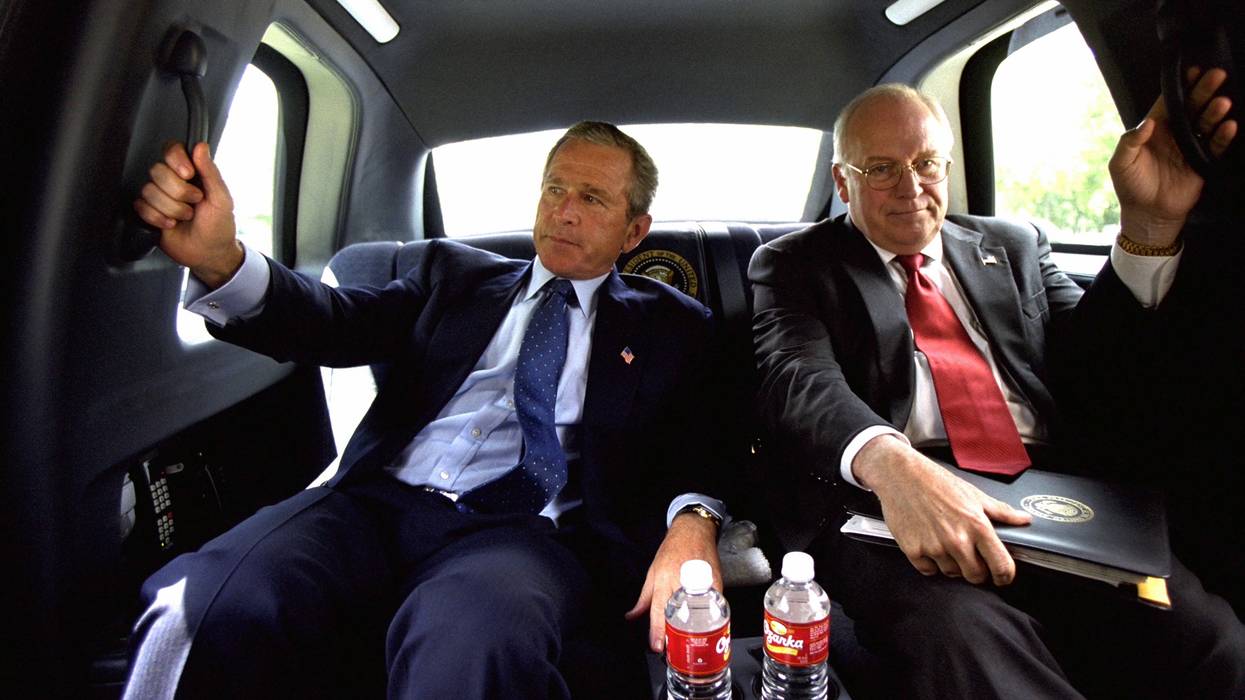 Dick Cheney and George W. Bush in a limo.