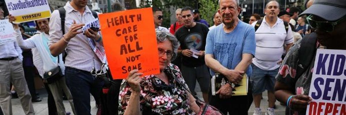Disability rights advocate holds sign.