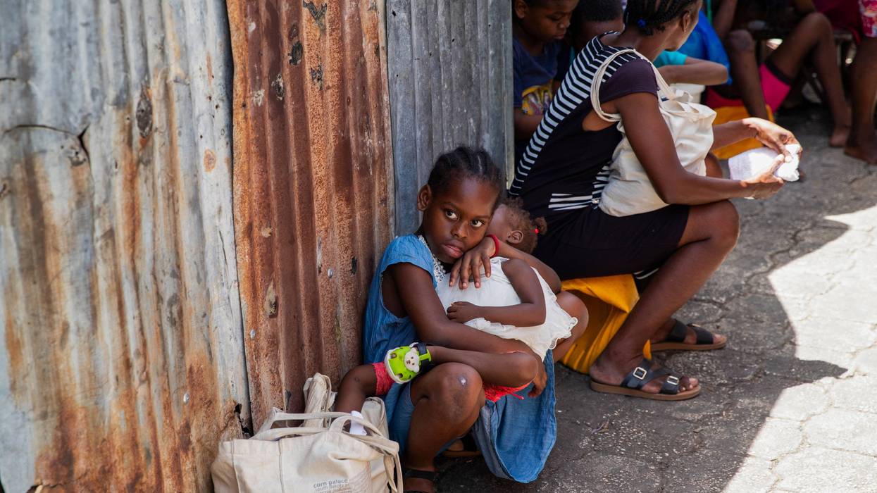Displaced Haitians are seen in a shelter camp