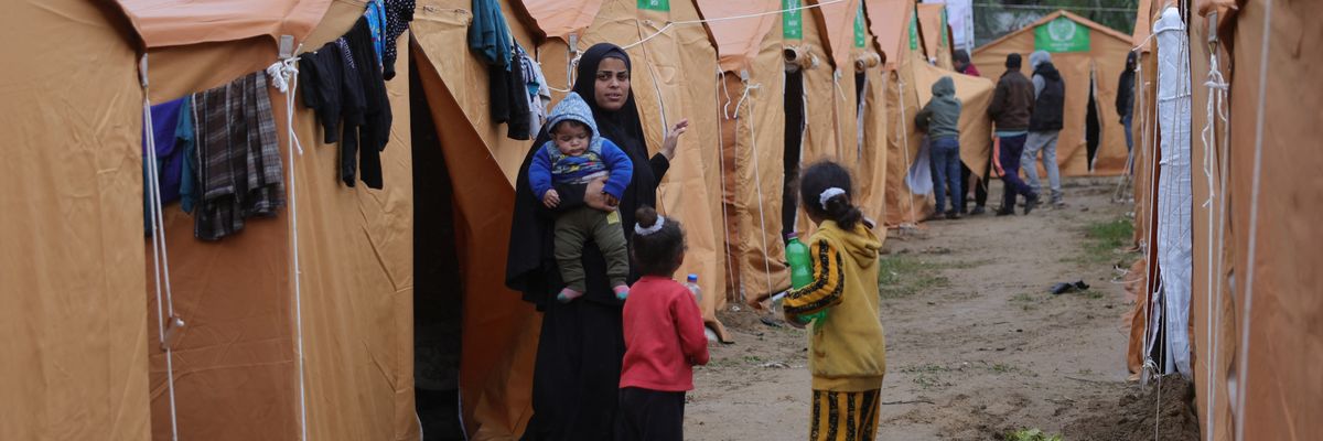 Displaced Palestinian families take refuge in tents