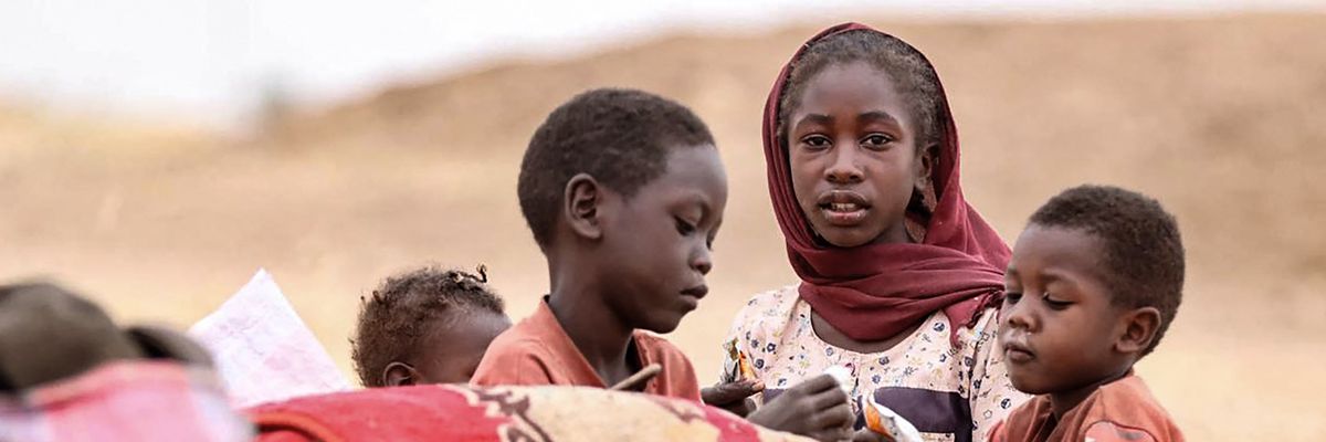 Displaced Sudanese children gather at a camp near the town of Tawila in North Darfur