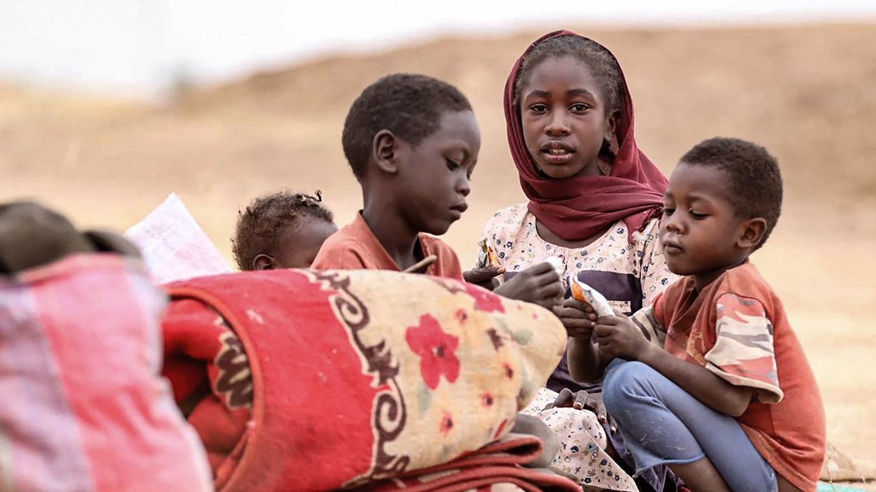 Displaced Sudanese children gather at a camp near the town of Tawila in North Darfur