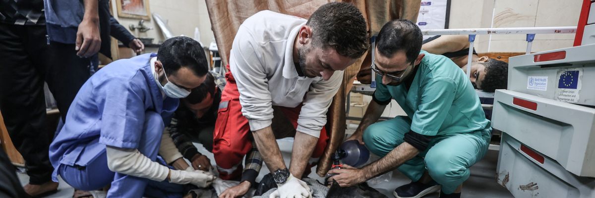 Doctors provide first aid to wounded Palestinians